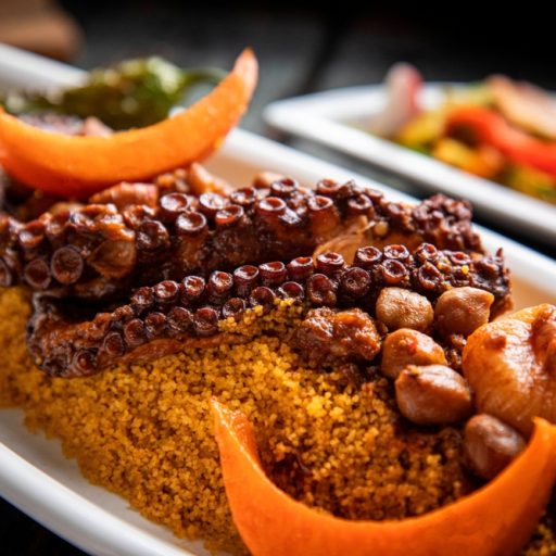 Tasty,Arabic,Couscous,With,Octopus,In,A,White,Dish